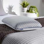 Sealy To Go Cool Touch Memory Foam Bed Pillow with Reversible Cooling Cover in White.