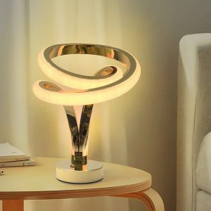 Modern trophy-style gold spiral LED lamp with vibrant RGB color-changing light.