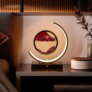 3D moving sand art LED lamp with black metal base and blue flowing sand landscape.