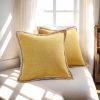 Set of 2 rustic gold linen-textured pillow covers with decorative burlap trim.