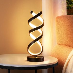 Modern matte black sculptural LED lamp with built-in USB charging ports.