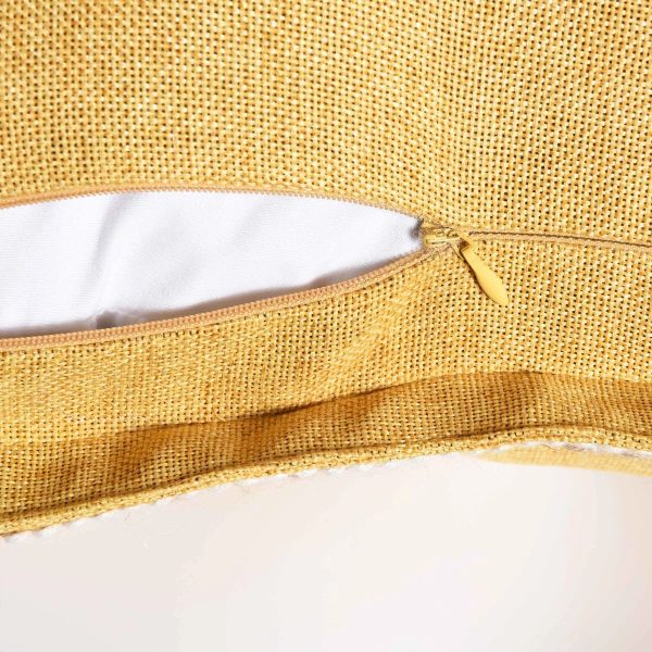 Mustard yellow accent pillows styled on a modern living room couch for a vintage look.
