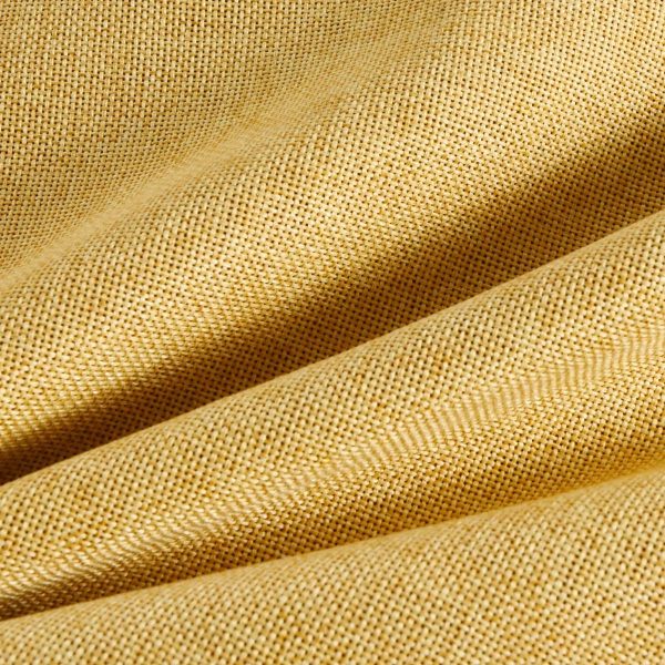 Mustard yellow accent pillows styled on a modern living room couch for a vintage look.